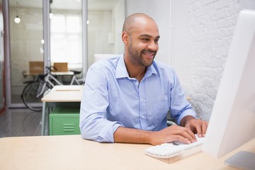 Businessman using computer at desk