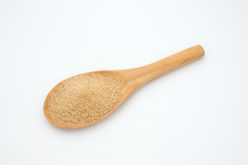 Brown sugar in a wooden spoon