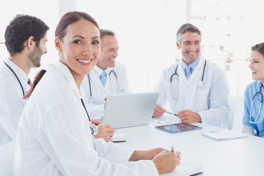 Doctors smiling and working together