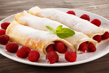 Pancakes with cream and raspberry