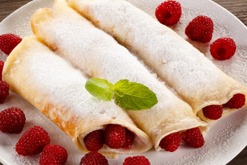 Pancakes with cream and raspberry