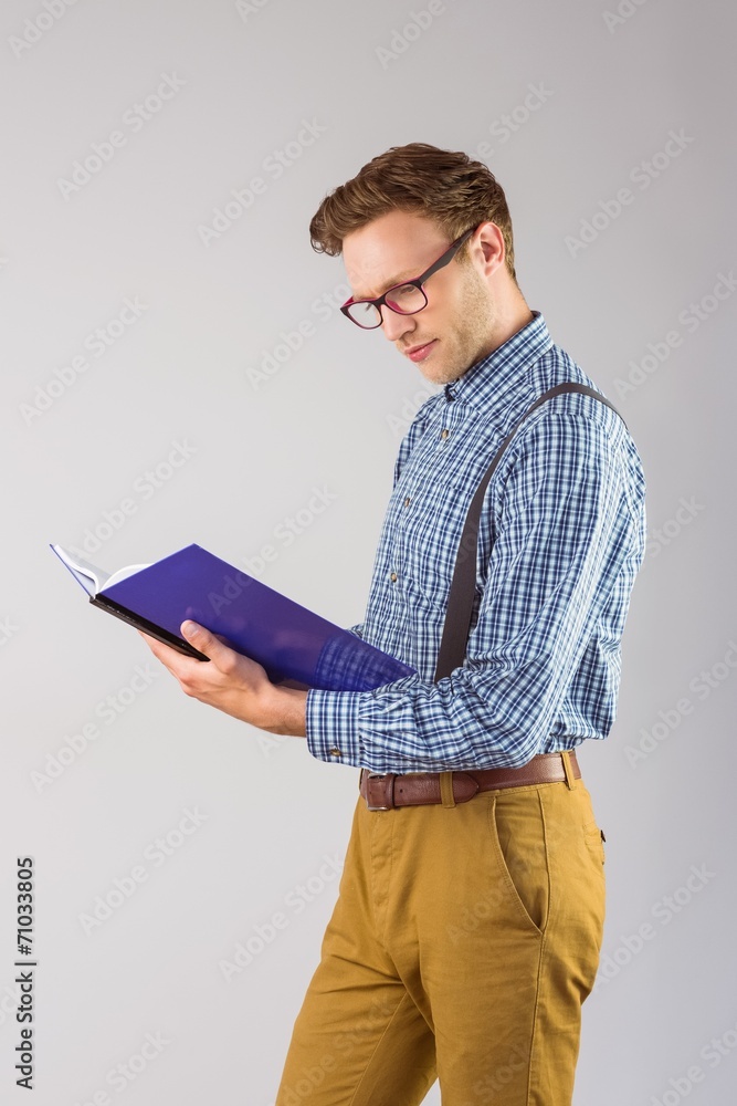 Poster geeky student reading a book