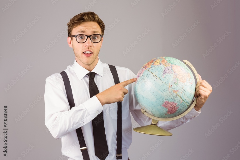 Poster geeky businessman pointing to globe
