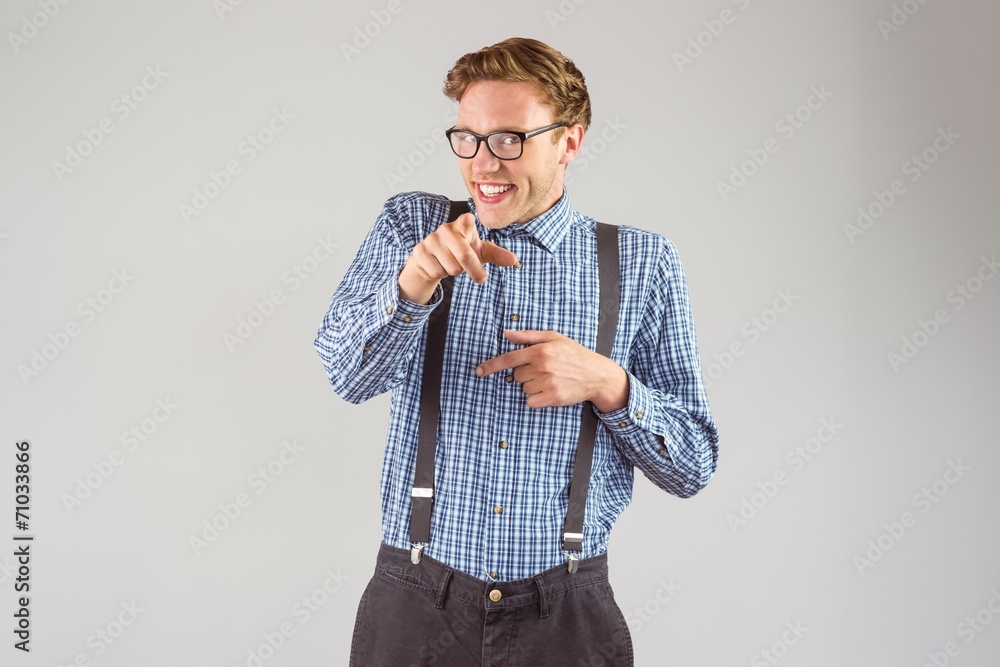 Poster Geeky hipster pointing at camera