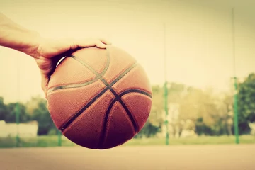 Fotobehang Dribbling with basketball ball. Vintage style © Photocreo Bednarek