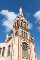 Fototapeta na wymiar Beautiful Brown Church Steeple Rising Into Sky