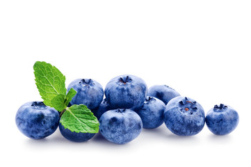 Fresh blueberry with green leafs of mint on white background