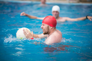 Water polo in the pool, a team of men