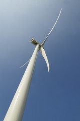 Wind generator under blue sky