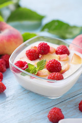 Yogurt with peaches and raspberry