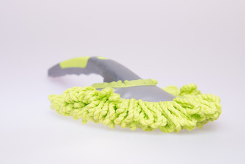 Green microfiber mop isolated on white