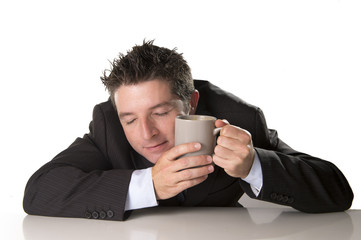 sleepy caffeine addict businessman holding take away coffee