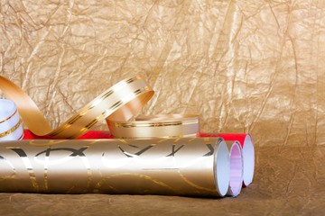 Rolls of multicolored wrapping paper with streamer for gifts on