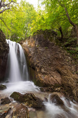 Naklejka na ściany i meble Deep forest waterfalls in the Transylvanian Alps