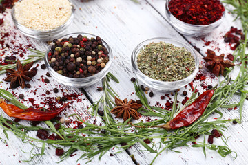 Spices in glass round bowls with herbs and chilly pepper