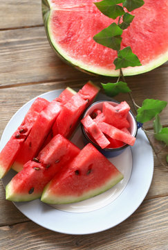 Fresh slices of watermelon on wooden table, close up