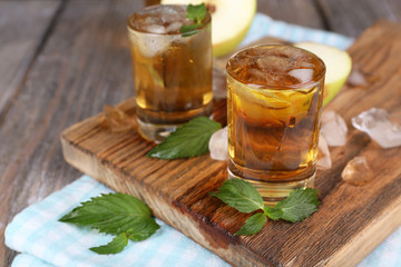 Still life with tasty apple cider in barrel and fresh apples