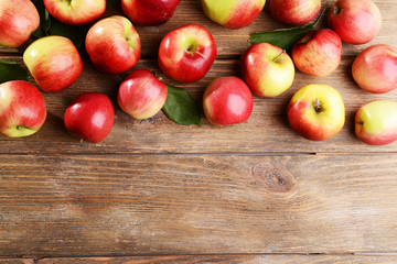 Sweet apples on wooden background