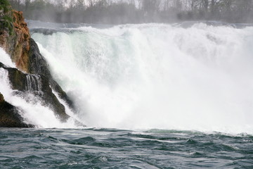Waterfall with white, foaming in spray