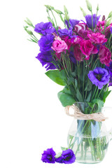 violet and mauve eustoma flowers in glass vase