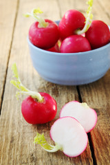 ripe radishes in a blue bowl