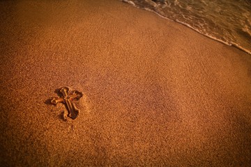 Cross Lying In The Sand