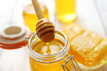 Fototapeta na wymiar Fresh honey on wooden table