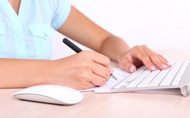 Fototapeta premium Businesswoman at her workplace, close-up