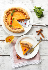 Homemade pumpkin pie on table