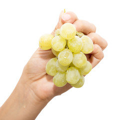 green grapes in a hand on a white background