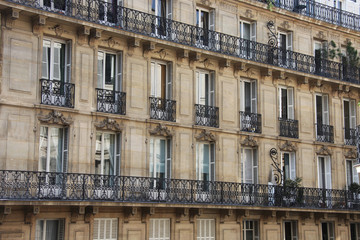 Fototapeta na wymiar Facade, windows and balconies of the houses