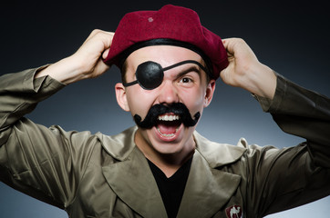 Funny soldier in military concept