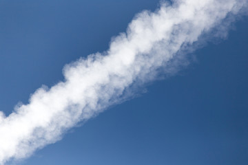 trace of an airplane against blue sky