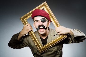 Funny soldier in military concept