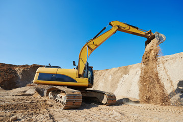 Fototapeta na wymiar excavator loader at earthmoving works