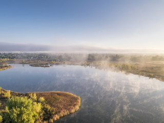 aerial view of a foggy lake