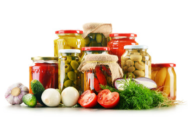 Composition with jars of pickled vegetables. Marinated food © monticellllo