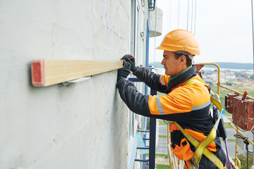 builder at facade construction work
