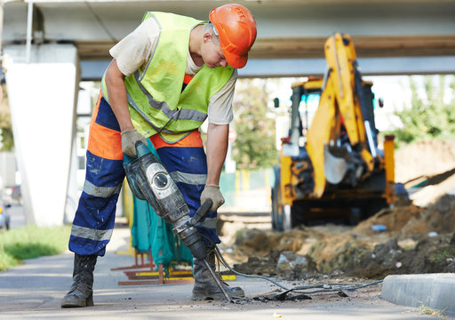 Construction Worker With Perforator