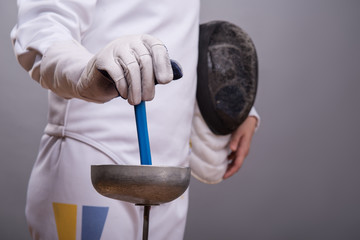 Young woman engaging in fencing