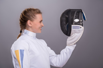 Young woman engaging in fencing