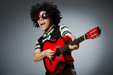 Obraz premium man with funny haircut and guitar