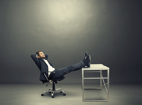 Businessman Put His Feet Up On The Table