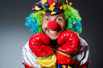 Funny clown with boxing gloves