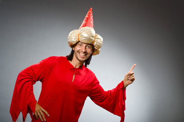 Funny wizard wearing red dress