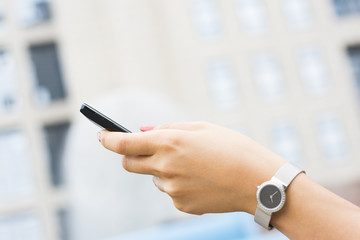Woman hands holding smartphone