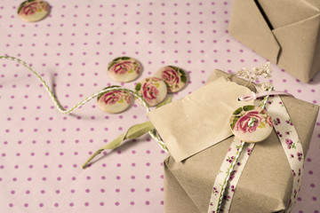 Gift wrapped in recyclable paper, ribbons, decorated with wooden