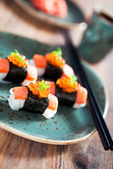 Shirataki sushi with salmon and caviar, selective focus