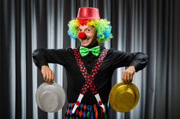  Funny clown in humorous concept against curtain