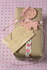 Gift wrapped in recyclable paper, ribbons and label flower